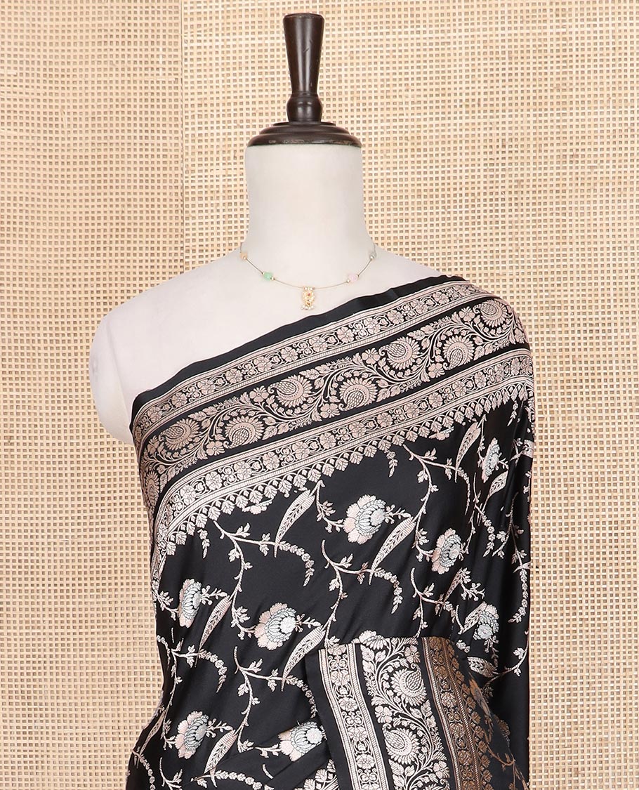 Black floral vine jacquard mushru silk saree, floral-paisley design zari border, and intricate pallu