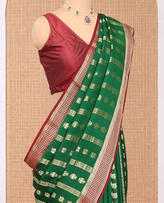 Green Mysore Silk Saree, Adorned with Peacock and Two-Headed Eagle Buttas, Complemented by a Contrast Traditional Zari Border, Intricate Pallu, and a Contrast Blouse