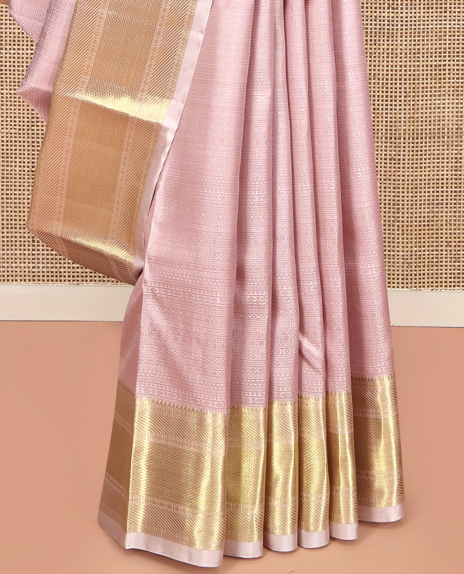 Baby Pink Geometric Embossed Parampara Silk Saree, Gleamed up with Zari Border of Rekku, Poun, Mayil Kann, and Zari Stripes, and Grand Jaal Pallu and Paired with a Matching Blouse