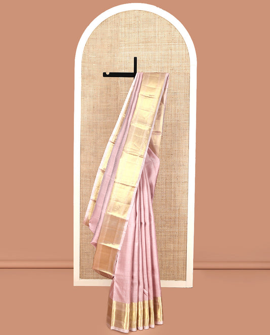 Baby Pink Geometric Embossed Parampara Silk Saree, Gleamed up with Zari Border of Rekku, Poun, Mayil Kann, and Zari Stripes, and Grand Jaal Pallu and Paired with a Matching Blouse
