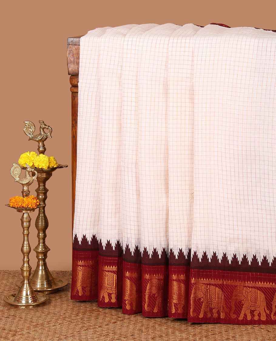 White zari checked sungudi cotton saree, contrast maroon temple & elephant motifs dual-border, striped pallu & contrast checked blouse