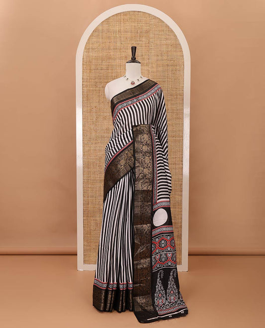 Black stripes printed soft dola saree,contrast floral creeper design zari border,Ajrakh-print pallu & blouse of floral butta & zari design