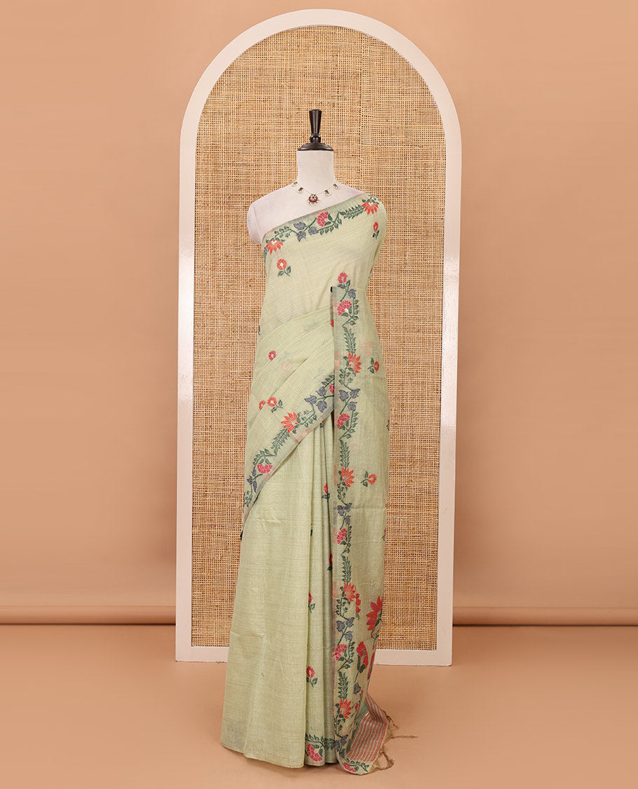Light green meena buttas woven linen saree, jamdhani-style floral design woven border, floral design pallu & contrast zari butta blouse