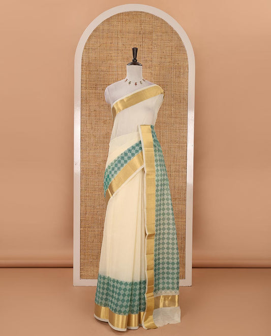 Cream with rama green kerala cotton saree , diamond style printed with gold zari tissue bawanchi border & diamond pattern printed pallu with plain blouse