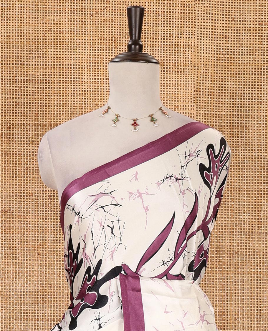 Cream-base batik-style floral printed satin crepe saree, contrast dark lavender border, printed pallu & contrast floral printed blouse