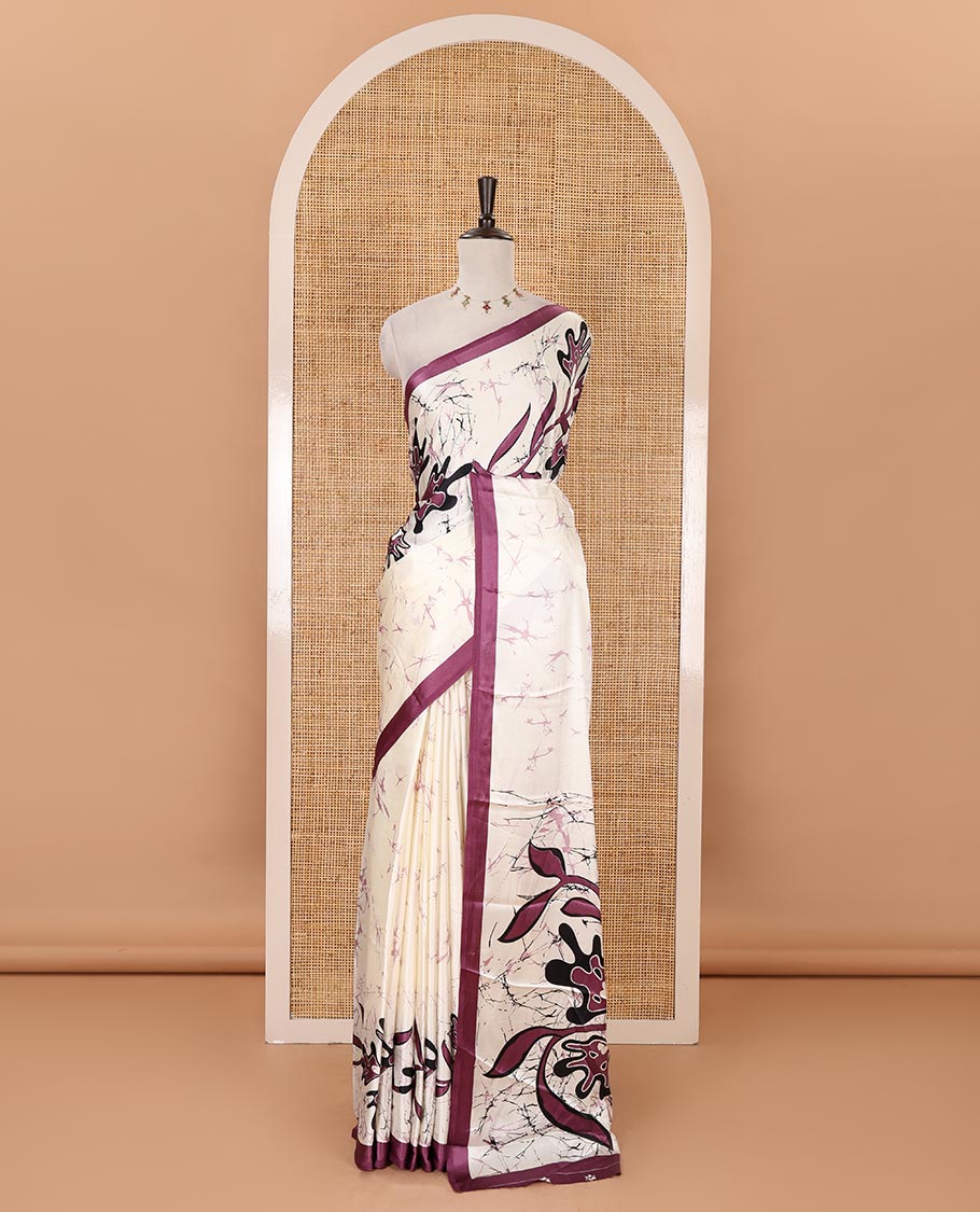 Cream-base batik-style floral printed satin crepe saree, contrast dark lavender border, printed pallu & contrast floral printed blouse