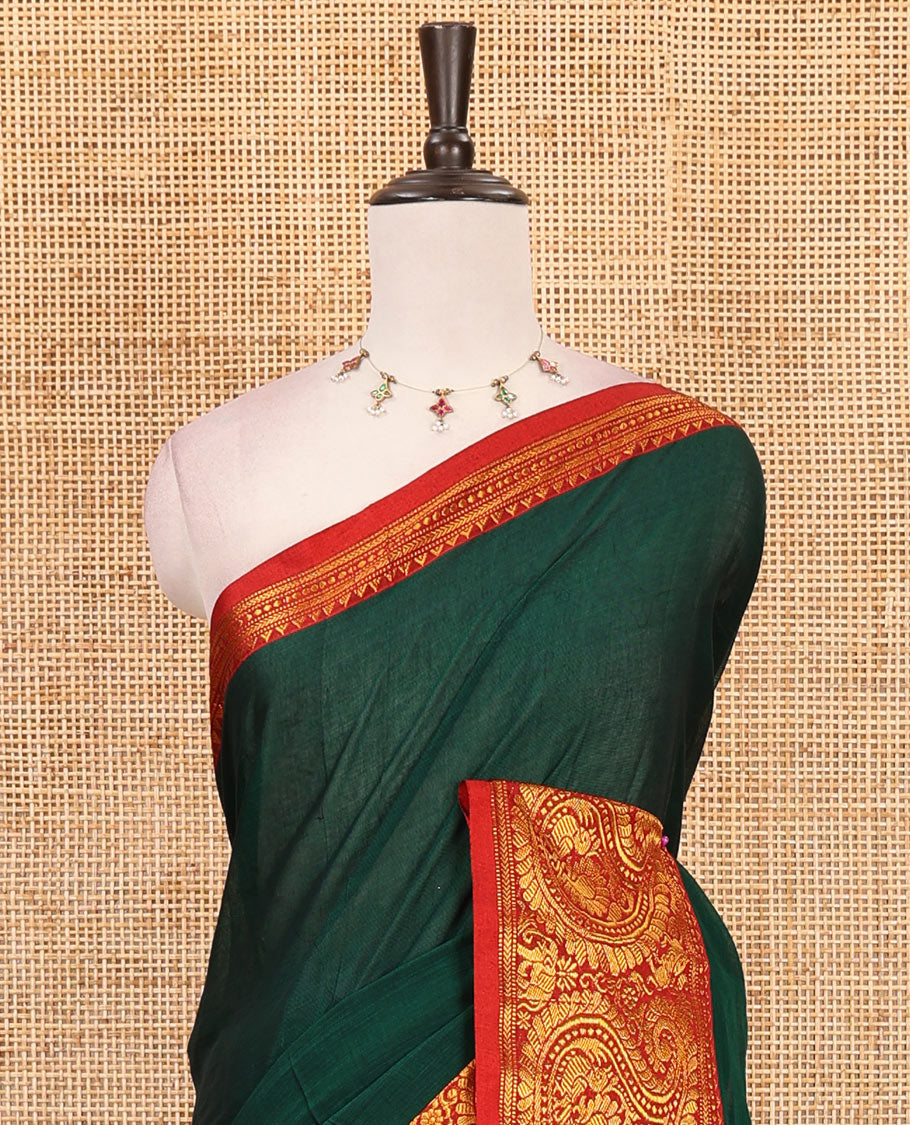 Green plain design mercerised cotton saree, contrast traditional peacock enclosed manga border, striped pallu & matching blouse