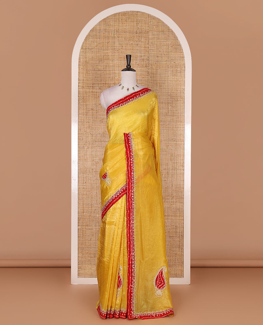 Yellow bandhani mango jhumka patch embroidered crunchy crushed saree, contrast border, and pallu of Swarovski stonework, bandhani dots, and bandhani printed blouse