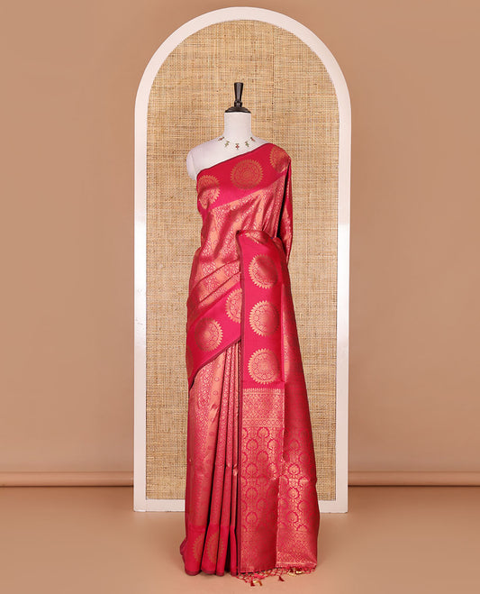 Pink jacquard kanchi tissue saree, zari chakram motifs border, intricately zari woven pallu, and a matching zari design blouse