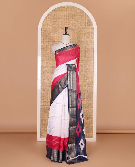 White zari design moss milan saree, contrast navy blue and pink colored traditional zari border, ikkat buttas printed pallu, and contrast zari design blouse