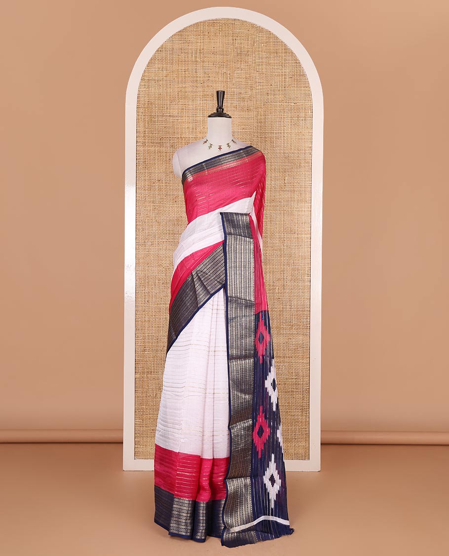 White zari design moss milan saree, contrast navy blue and pink colored traditional zari border, ikkat buttas printed pallu, and contrast zari design blouse