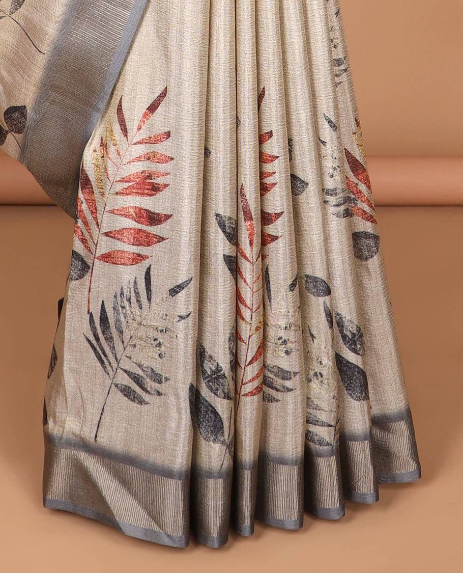 Cream leaf print tussar saree with tissue border & crush tissue pallu along with crush leaf print blouse
