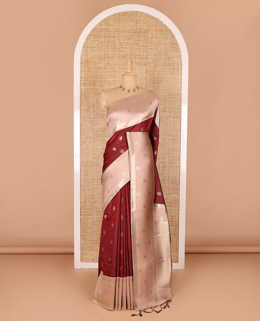 Maroon zari buttas soft silk saree, contrast zari border of intricate designs, zari-rich jaal pallu, and a contrast zari design blouse