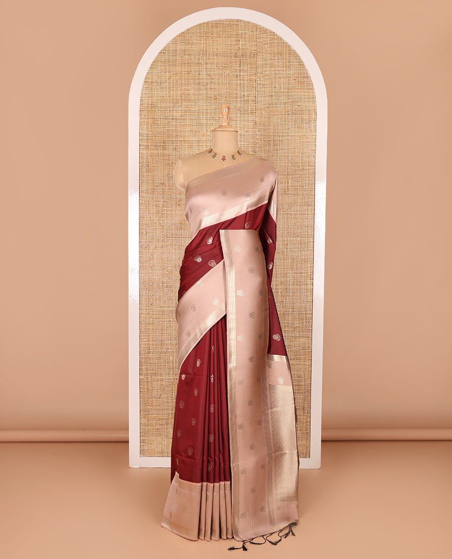 Maroon zari buttas soft silk saree, contrast zari border of intricate designs, zari-rich jaal pallu, and a contrast zari design blouse