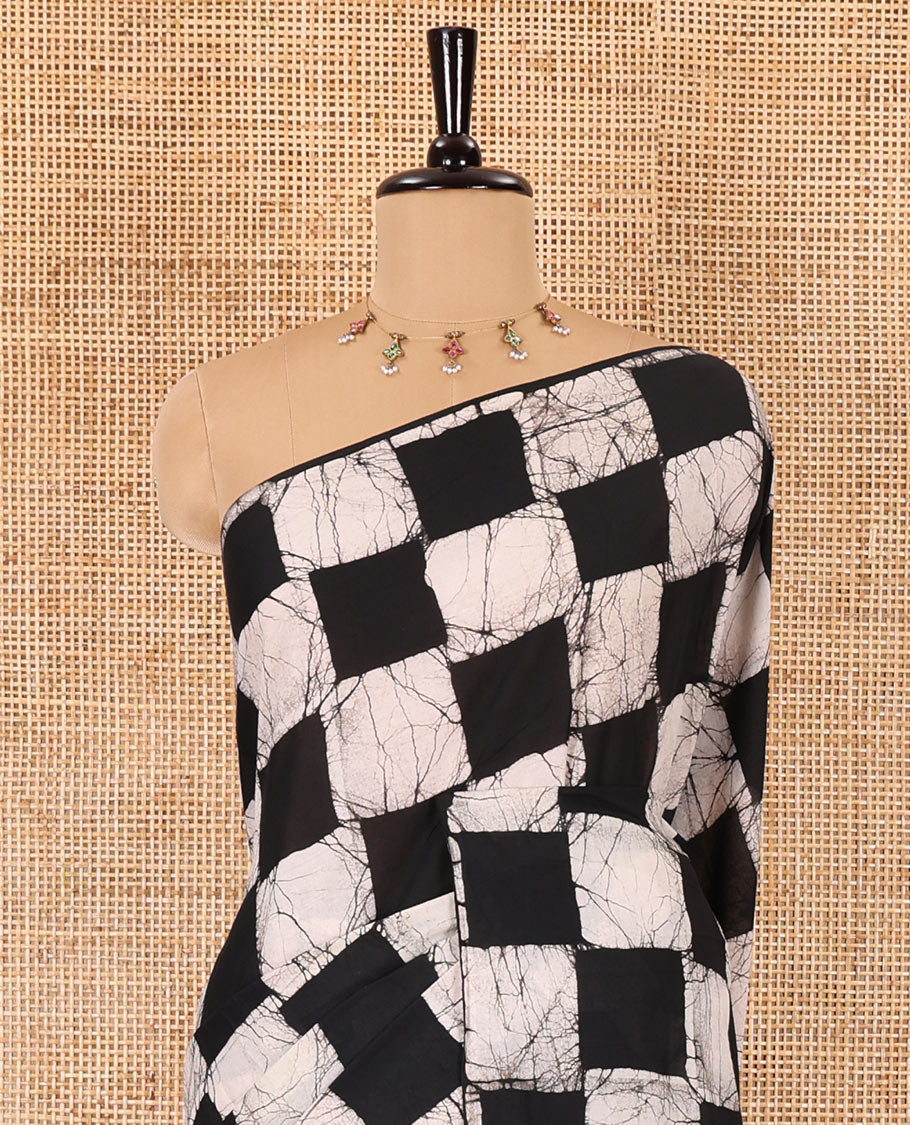 Borderless black green chess theme batik printed mul cotton saree with contrast leheriya striped pallu, and a contrast batik printed blouse