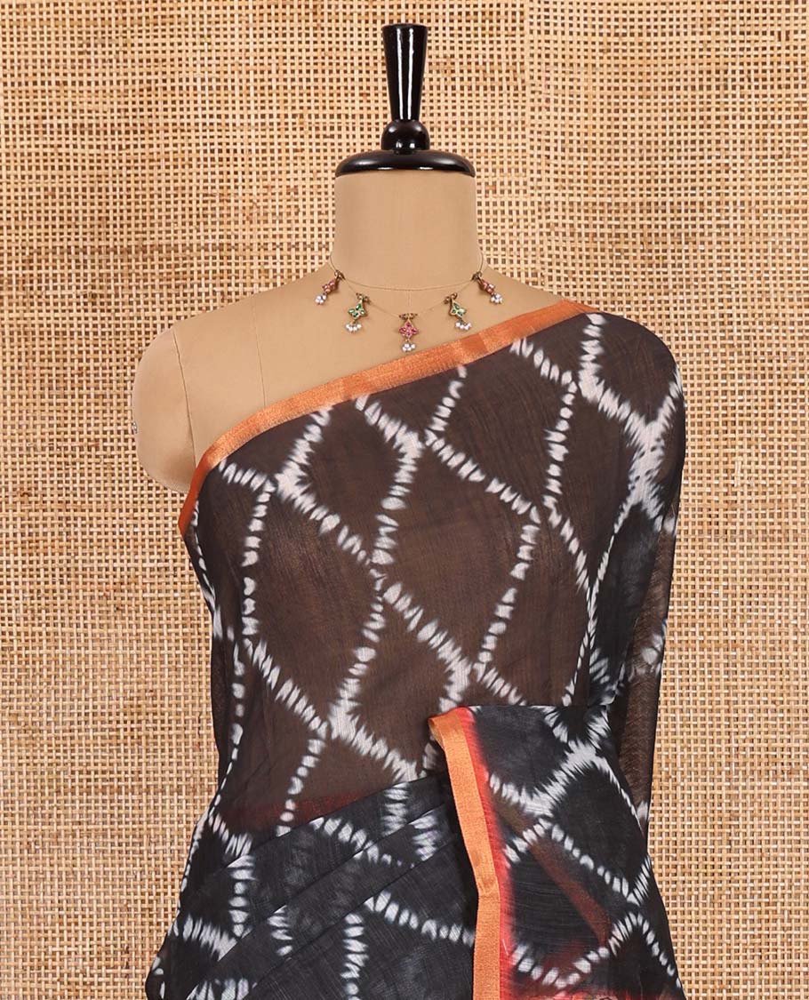 Black argyle shibori printed linen cotton saree, contrast border, kalamkari floral vine printed pallu, and a contrast kalamkari printed blouse