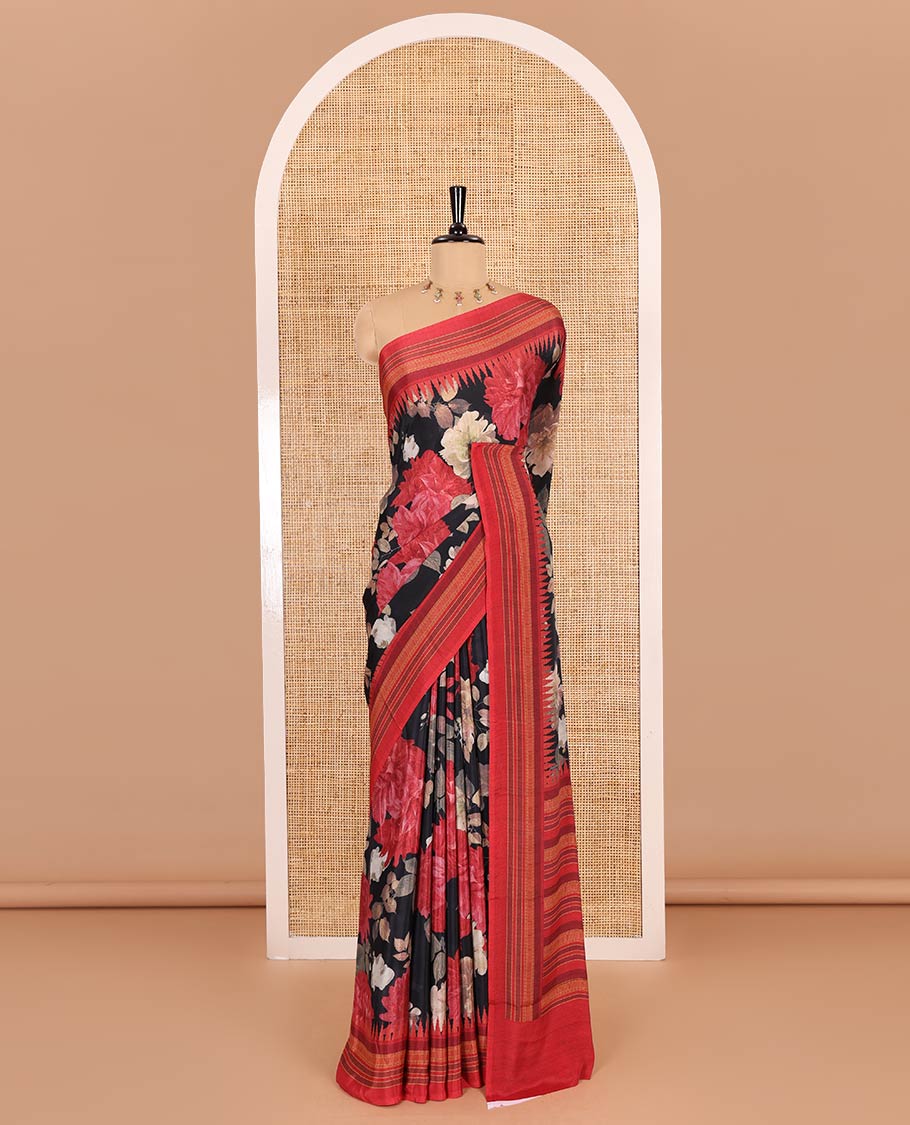 Black floral printed Italian crepe saree, contrast temple printed border, striped pallu, and a printed bordered blouse