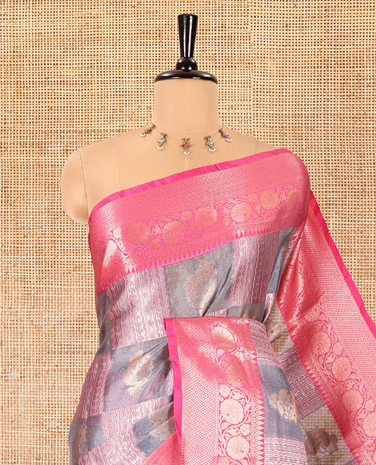 Grey and pink floral and geometric patterns tissue silk saree, contrast traditional zari border of floral creeper designs, intricate pallu, and a jacquard blouse