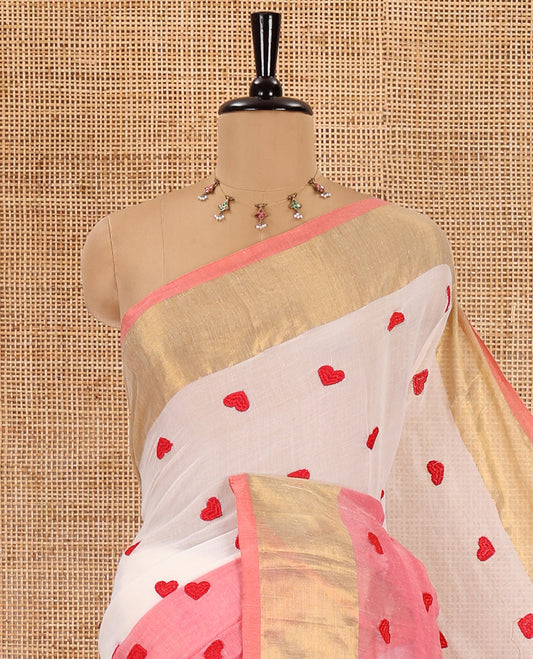 Peach heart motifs, red thread-embroidered half-and-half khadi mul cotton saree, zari border, self-pallu, and a plain blouse
