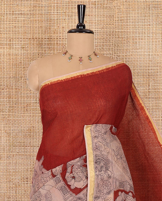 Maroon kalamkari ancient human figurines printed kota cotton saree, zari piping border, kalamkari floral-peacock printed pallu, and a contrast kalamkari printed blouse
