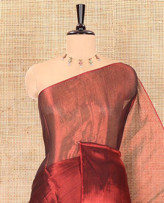 Borderless maroon plain khadi tissue saree self pallu with tassels and a matching blouse
