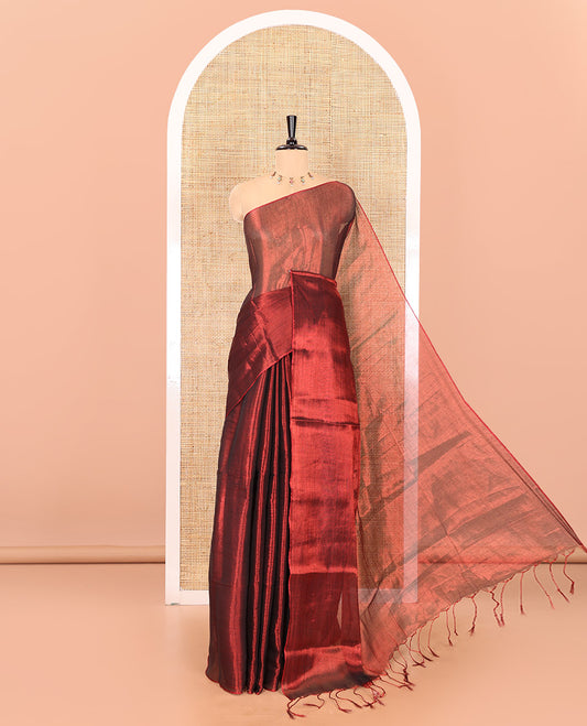 Borderless maroon plain khadi tissue saree self pallu with tassels and a matching blouse