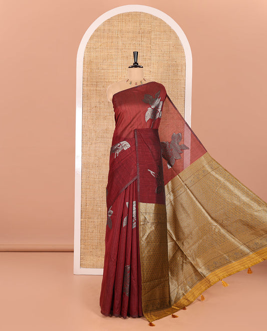 Borderless Maroon Kicha Tussar Saree Artfully Woven with Big Zari Floral Motifs All Over Its Body, Complemented by Intricately Zari-Woven Pallu, and a Contrast Blouse