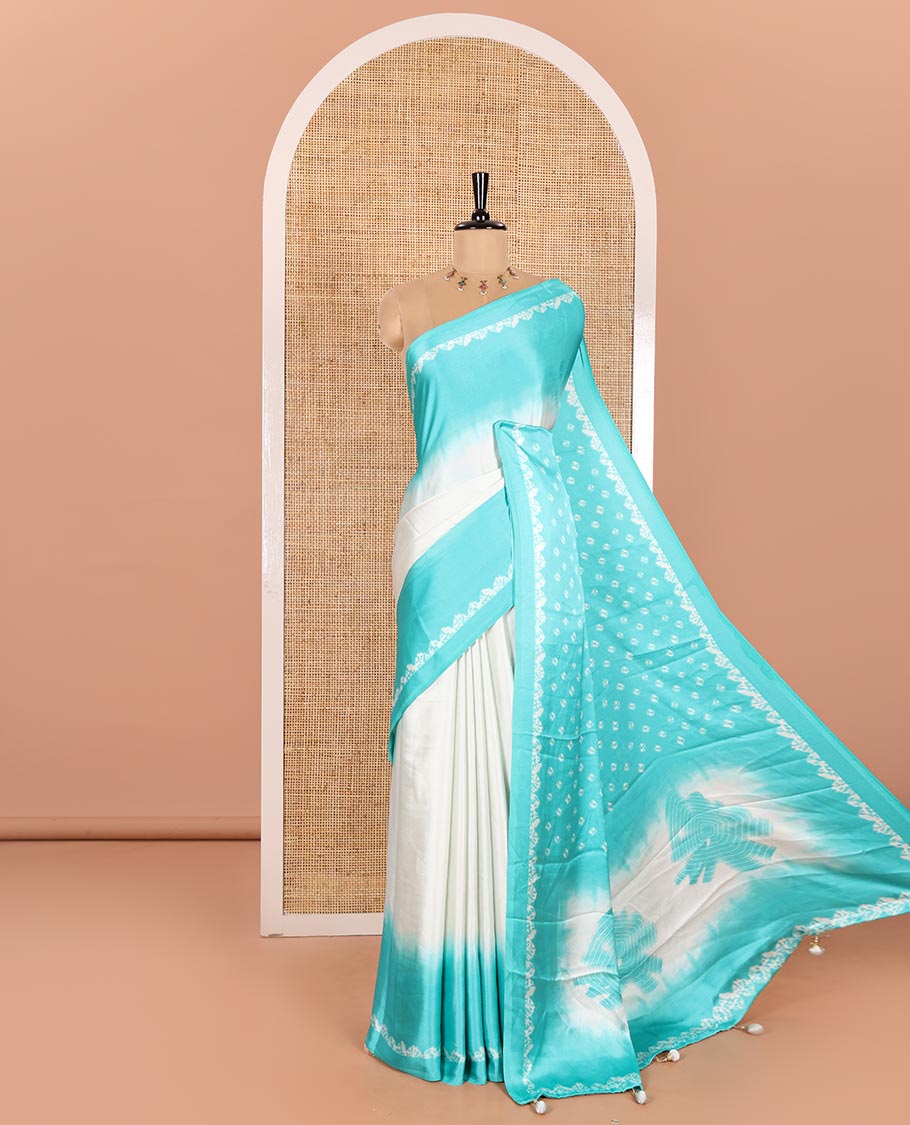 Cream and Sea Green Satin Crepe Saree Decked Up with Shibori Prints, Complemented by Contrast Shibori Printed Border, Pallu Decked Up with Shibori Prints, and Paired with a Plain Blouse