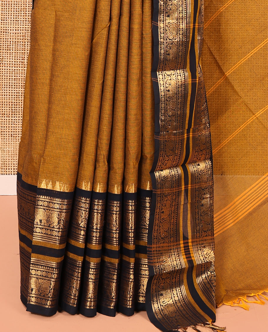 Mustard Plain Chettinad Cotton Saree, Complemented by a Contrast Rettai Pettu One-Sided Zari Border of Temple, Paisa, Elephant, and Peacock Designs, Subtly Striped Pallu, and Paired with a Matching Blouse