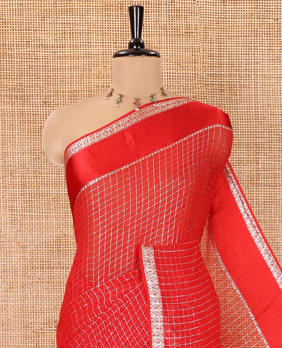 Scintillating Red Viscose Georgette Saree Gleamed Up with Checked Design on Its Body, Highlighted by a Double-Pet Border, Zari Checked Design Pallu, and Paired with a Matching Blouse