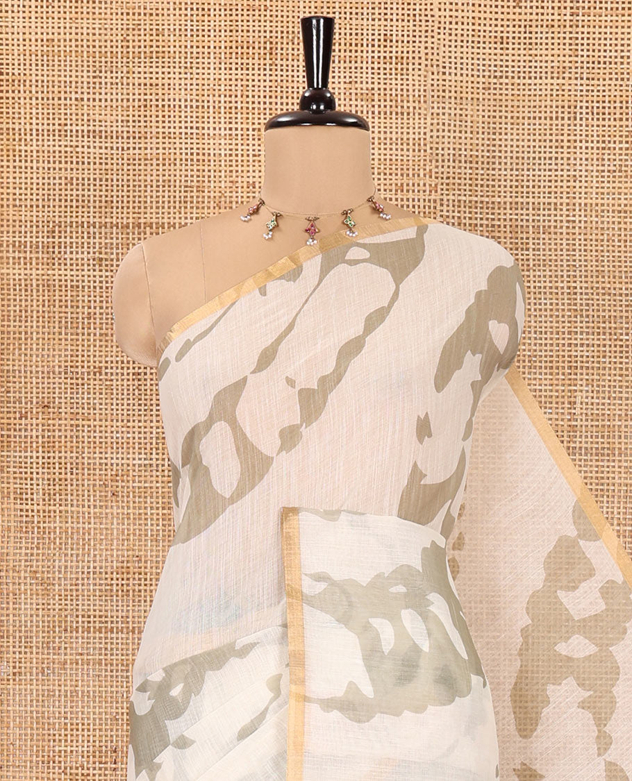 Cream Linen Saree, Bedecked with Abstract-Style Print on Its Body, Subtle Piping Border, Captivating Pallu of Floral Vine Print, and Paired with a Contrast Floral Printed Blouse