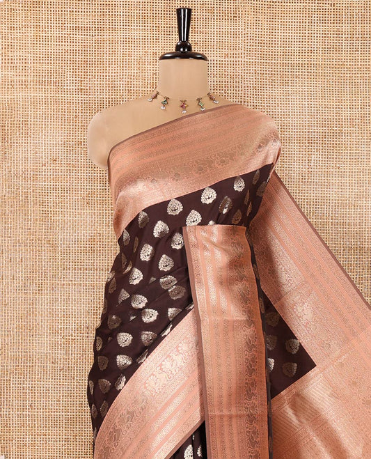 Brown and Peach Kanchi Silk Saree, Spotlighted with Zari Buttas All Over Its Body, Complemented by a Contrast Traditional Zari Border of Peacock Designs, an Intricately Designed Pallu, and Paired with a Contrast Blouse