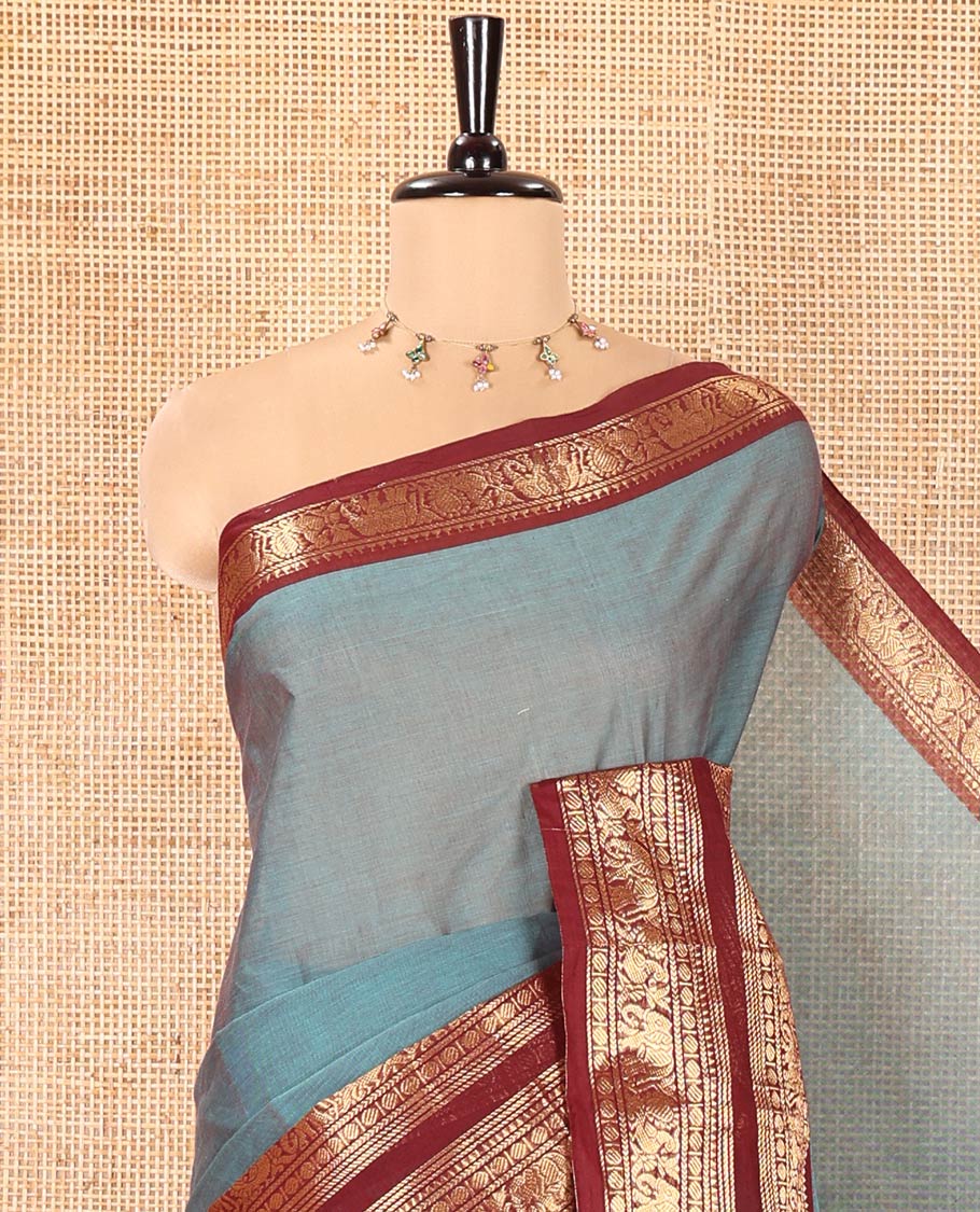 Teal Plain Chettinad Cotton Saree, Complemented by a Contrast Traditional Zari Design Rettai Pettu Border of Peacock and Elephant Designs, Pallu of Stripes, and Paired with a Matching Blouse