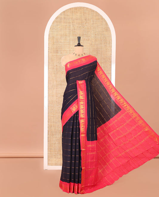 Navy Blue Sungudi Cotton Saree, Elevated with Veldhari Zari Stripes All Over Its Body, Complemented by a Contrast Temple Border of Peacock Designs, Zari Design Pallu, and Paired with a Contrast Blouse