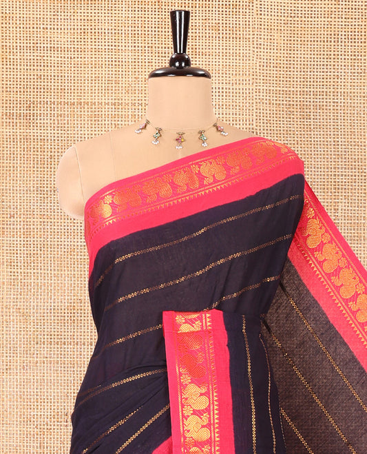 Navy Blue Sungudi Cotton Saree, Elevated with Veldhari Zari Stripes All Over Its Body, Complemented by a Contrast Temple Border of Peacock Designs, Zari Design Pallu, and Paired with a Contrast Blouse