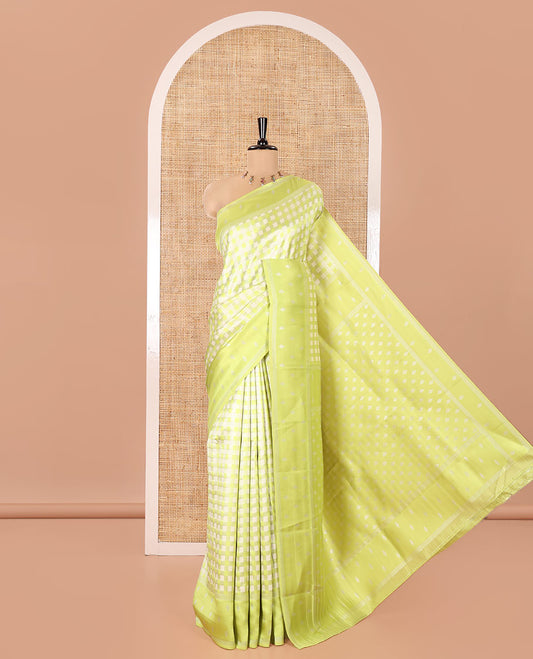 Green Kanchi Silk Saree, Accentuated with Checked Design on Its Body, Highlighted by a Self-Border of Diamond Patterns, Pallu Steeped with Buttas, and Paired with a Matching Blouse