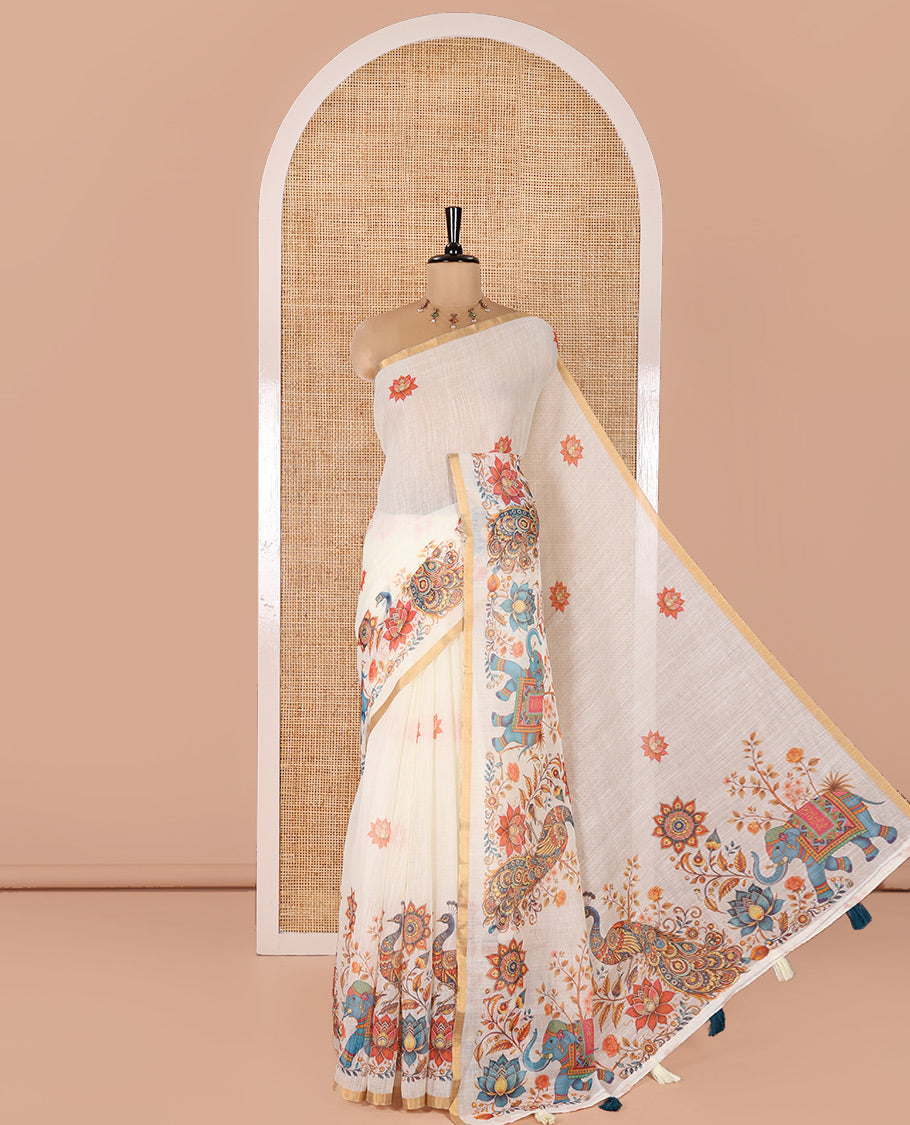 Cream Linen Cotton Saree, Elevated with Lotus, Floral, Elephant, and Peacock Motifs Printed on Its Body, Subtle Piping Border, a Self-Pallu, and Paired with a Matching Blouse