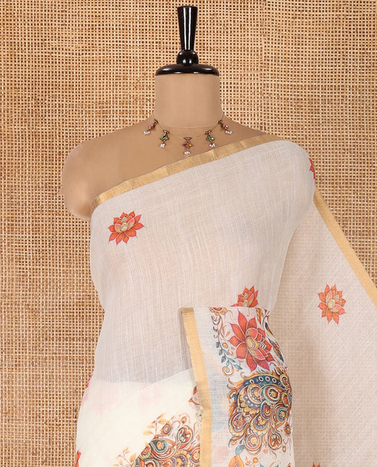 Cream Linen Cotton Saree, Elevated with Lotus, Floral, Elephant, and Peacock Motifs Printed on Its Body, Subtle Piping Border, a Self-Pallu, and Paired with a Matching Blouse