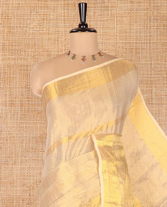 Gleaming Gold Khadi Tissue Saree, Elevated with Zari Stripes All Over Its Body, Highlighted by Zari Bavanji Border, Zari Striped Pallu, and Paired with a Matching Blouse