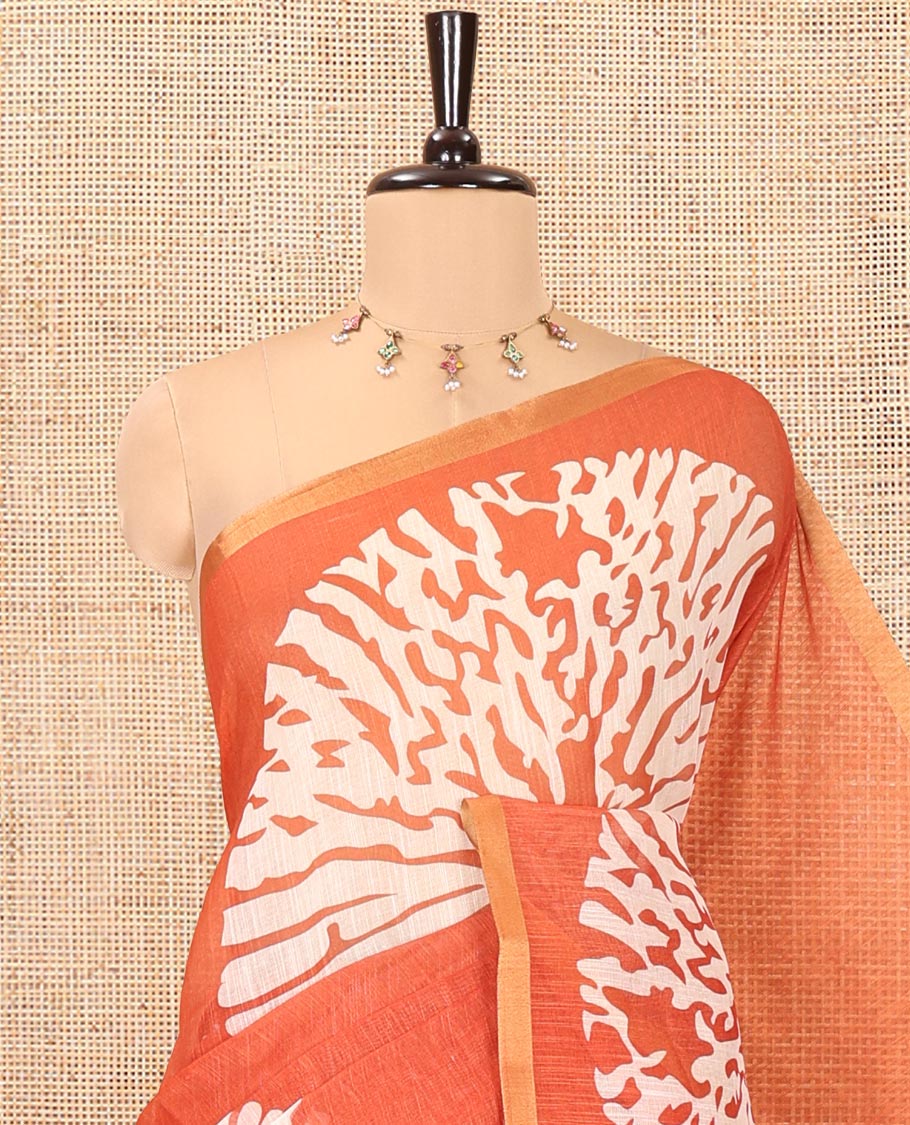 Rust Linen Cotton Saree, Elevated with Floral Motifs Printed on Its Body, Subtle Piping Border, Complemented by a Contrast Floral Printed Blouse, and Paired with a Contrast Blouse