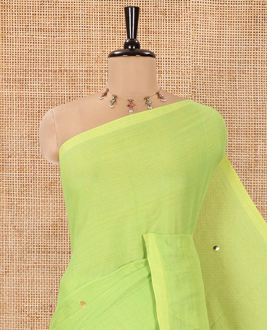 Borderless Parrot Green Mul Cotton Saree, Subtly Sparkled With Big Sequins Work On Its Body, a Self-Pallu and Paired with a Matching Blouse