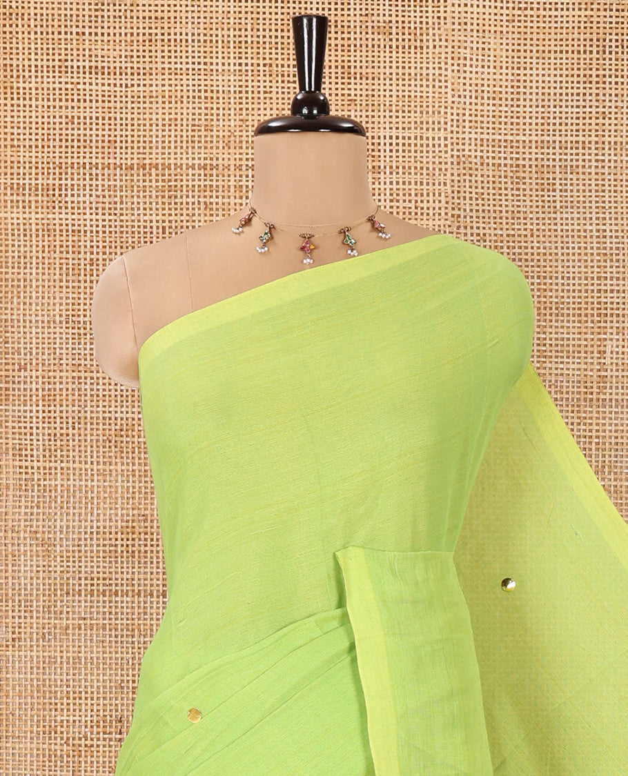 Borderless Parrot Green Mul Cotton Saree, Subtly Sparkled With Big Sequins Work On Its Body, a Self-Pallu and Paired with a Matching Blouse