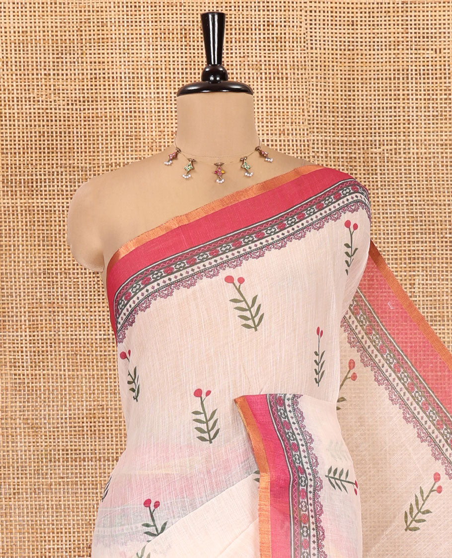 Cream-Pink Linen Cotton Saree Features Floral Buttas, Contrast Printed Border, Intricate Pallu, and a Contrast Blouse