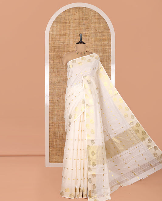 Cream Kerala Cotton Saree, Spotlighted with Zari Buttas, Highlighted by Zari Border, Intricate Pallu, and a Matching Blouse