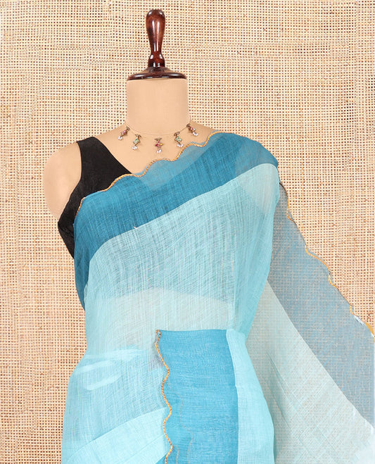 Sea Green Plain Linen Cotton Saree, Contrast Plain Scallop Border, a Self-Pallu, and Contrast Kalamkari Printed Blouse