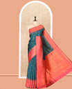 Green Art Kanchi Silk Saree, Adorned with Buttas, a Contrast Traditional Zari Border, Intricate Pallu, and a Contrast Blouse