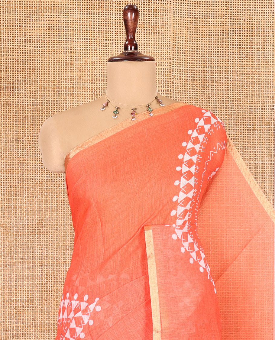 Fanta Orange Linen Cotton Saree Features Warli Print, a Contrast Piping Border, a Floral-Printed Pallu, and a Contrast Blouse