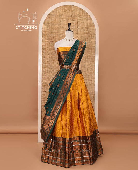 Mustard semi-banaras half-saree, embossed & contrast traditional zari border skirt,blouse of embossed & zari work & contrast green zari design dhavani
