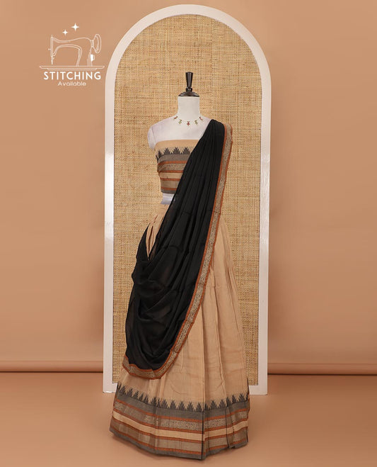 Chikku mercedised cotton half-saree, contrast traditional resham thread border skirt, matching blouse & contrast green thread border georgette dhavani