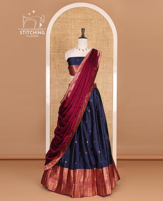 Navy blue taffeta silk half saree, floral zari buttas with contrast maroon traditional zari border skirt, matching zari design blouse, and contrast plain zari border syska georgette dhavani